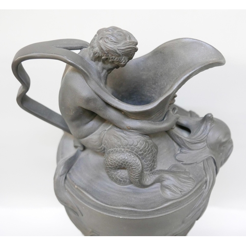 2194 - A large Wedgwood black jasper wine or water ewer, modelled with Neptune seated on the shoulder of th... 