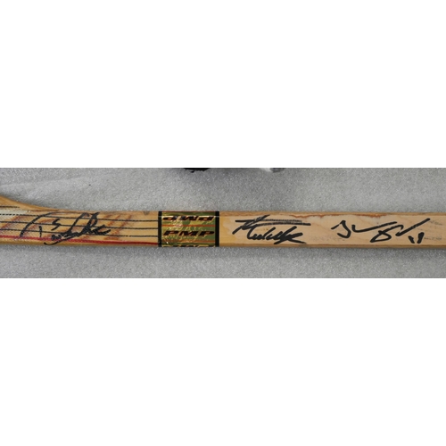 2229 - Nottingham Panthers memorabilia; Paul Adey ice hockey stick, signed, programmes including Benson & H... 