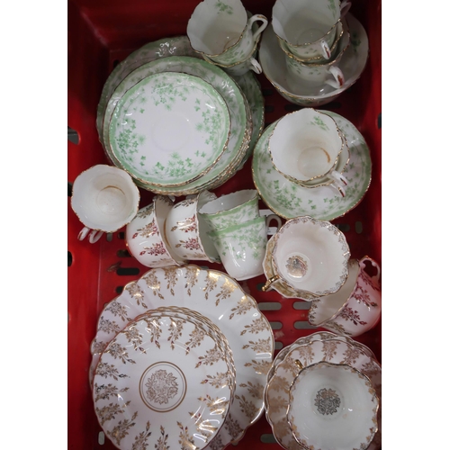 2260 - A collection of bone china and porcelain comprising a Bristol plum dinner service and two tea sets *... 