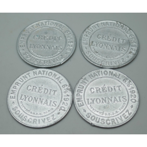 2303 - Four French 1920 Business Tokens, aluminium capsules with postage stamp held by a mica disc