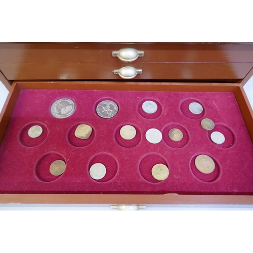 2311 - A collectors cabinet with coins and a WWII medal