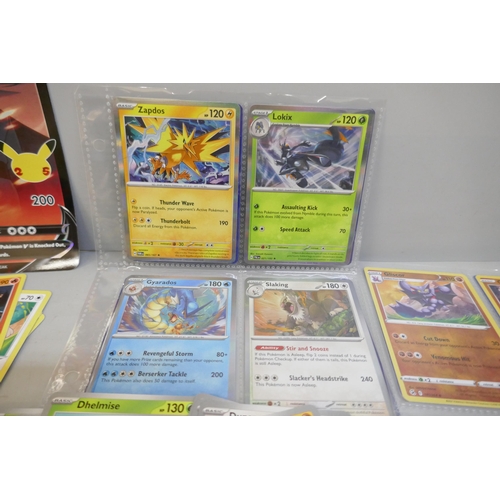 2312 - A box of over 600 Pokémon cards including holographic and rare cards with a large promo card