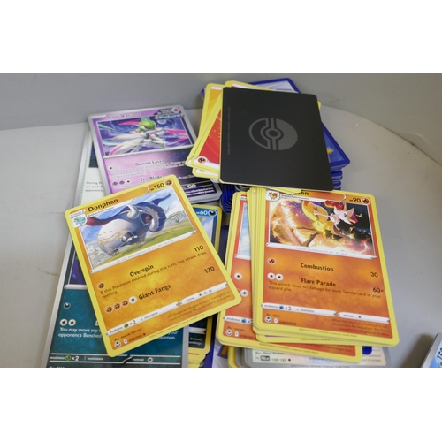 2312 - A box of over 600 Pokémon cards including holographic and rare cards with a large promo card