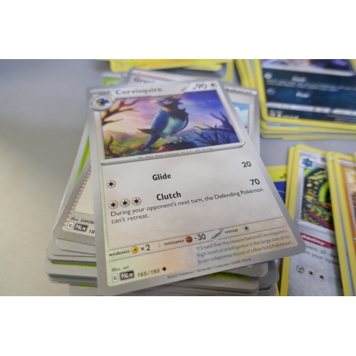 2312 - A box of over 600 Pokémon cards including holographic and rare cards with a large promo card