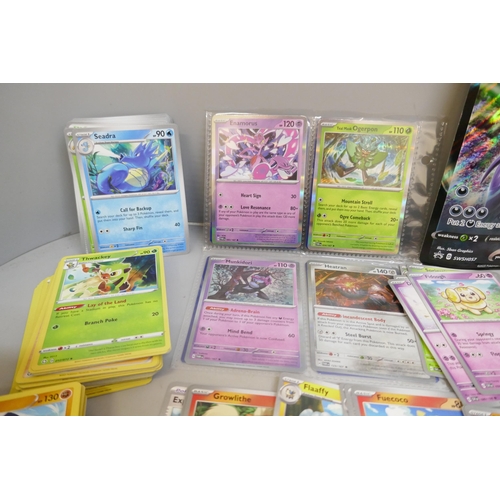 2313 - A box of over 600 Pokémon cards including holographic and rare cards with a large promo card