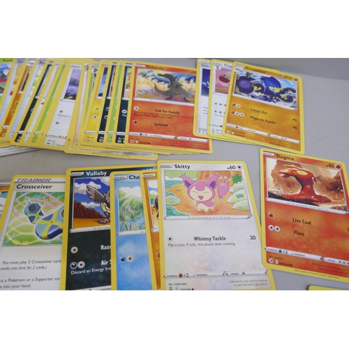 2313 - A box of over 600 Pokémon cards including holographic and rare cards with a large promo card