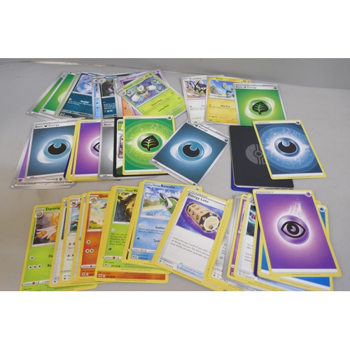 2313 - A box of over 600 Pokémon cards including holographic and rare cards with a large promo card