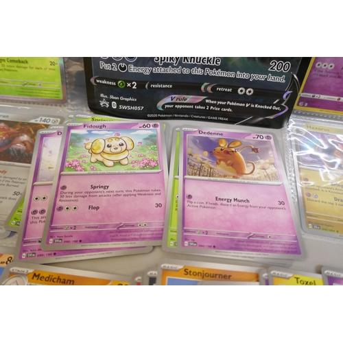 2313 - A box of over 600 Pokémon cards including holographic and rare cards with a large promo card