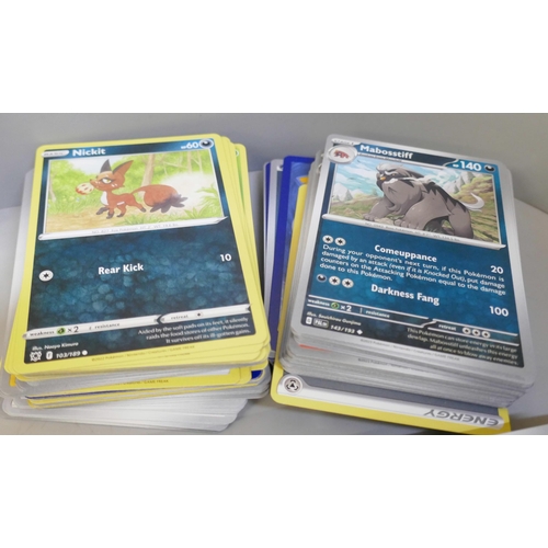 2313 - A box of over 600 Pokémon cards including holographic and rare cards with a large promo card