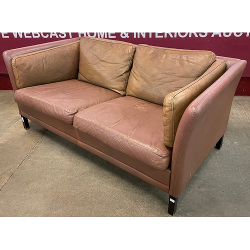 87 - A Danish brown leather sofa, manner of Borge Mogensen