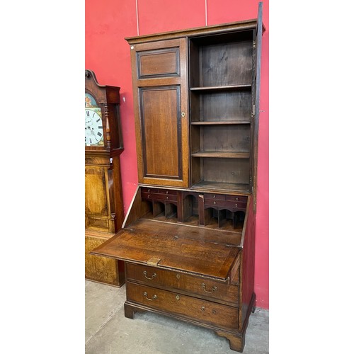 102 - A George III oak bureau bookcase