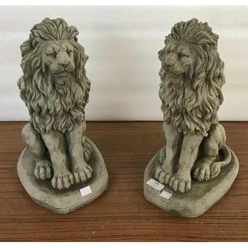 191 - A pair of concrete garden figures of seated lions