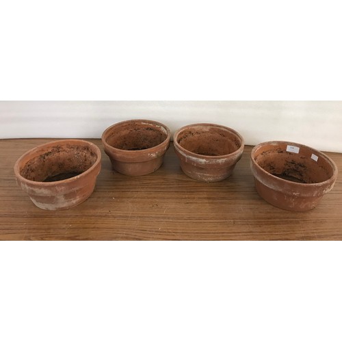 210 - Four small terracotta plant pots