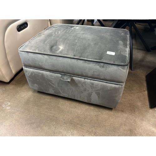 3006 - A grey velvet upholstered ottoman footstool (slight crack inside)