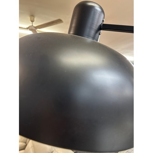 3021 - A black painted floor standing anglepoise lamp