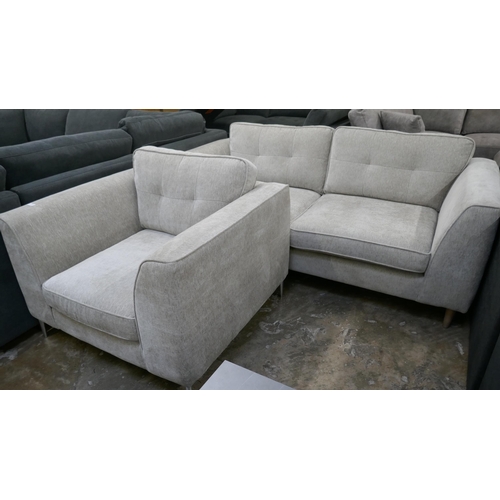 3030 - An oatmeal fabric upholstered three seater sofa and armchair (mixed feet)