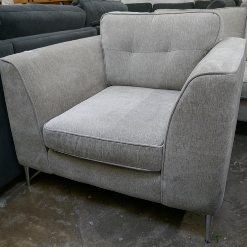 3030 - An oatmeal fabric upholstered three seater sofa and armchair (mixed feet)