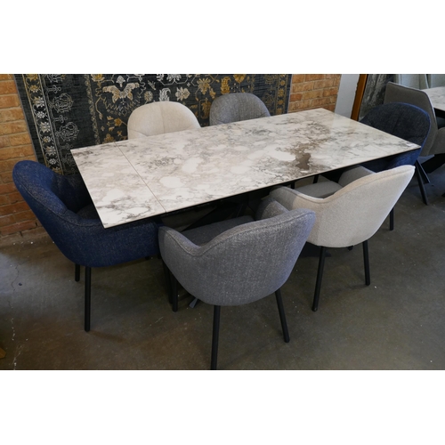 3042 - A Kos extending dining table and a harlequin set of six fabric upholstered dining chairs *This lot i... 