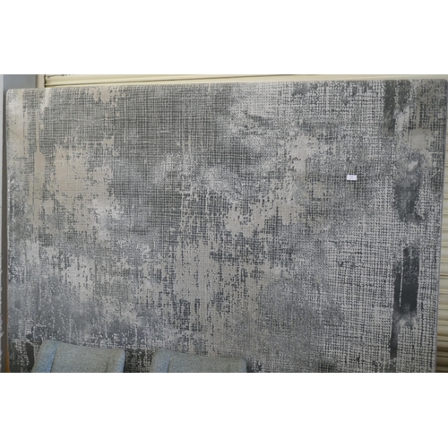 3058 - A contemporary patterned grey ground rug, 300cm x 200cm