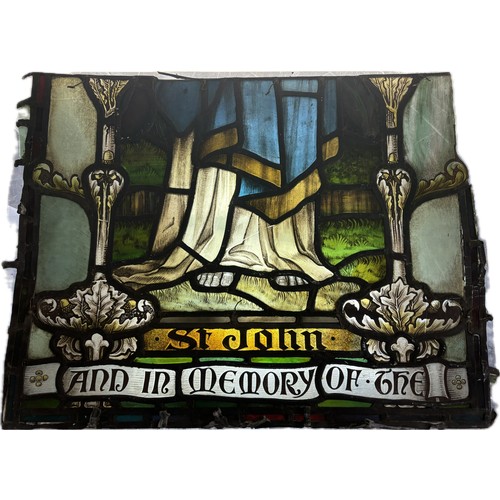 9054 - An Ecclesiastical leaded stained glass panel, depicting St. John, bearing inscription, And in Memory... 