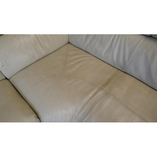 3265 - A cream leather upholstered sectional corner sofa with power headrests - (transit marks), Original R... 