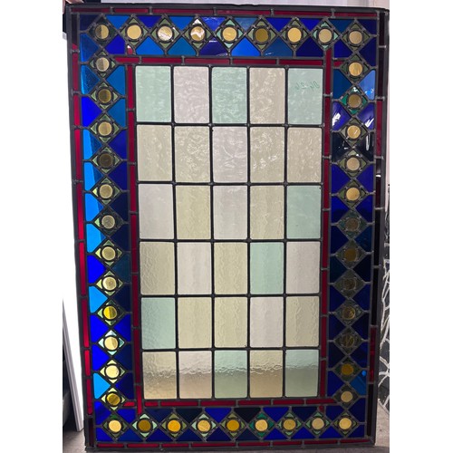 9061 - Four Medieval style leaded stained glass panels, 113 x 79cms, 86 x 86cms, 128 x 80cms