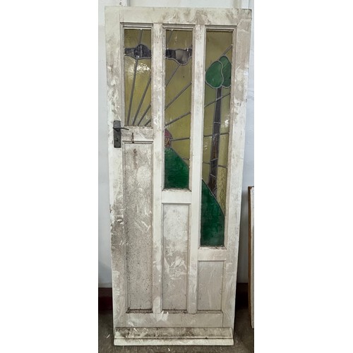 9062 - An Art Deco stained glass door, 204 x 81cms