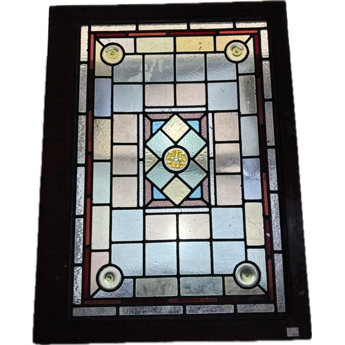 9063 - A pair of 19th Century stained glass bullseye window panes, one framed (excl. frame 67 x 46cm)