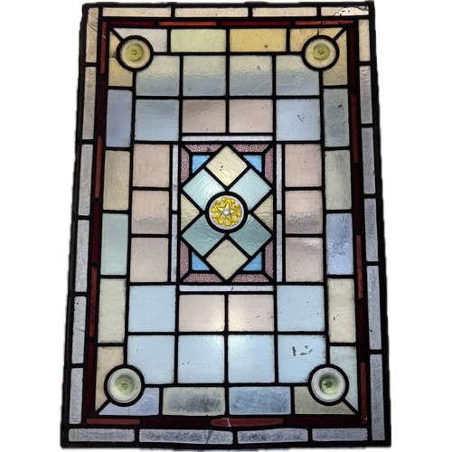 9063 - A pair of 19th Century stained glass bullseye window panes, one framed (excl. frame 67 x 46cm)