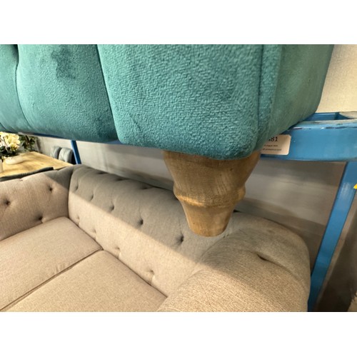 3025 - A turquoise velvet upholstered Chesterfield three seater sofa with patterned scatter cushions on tur... 