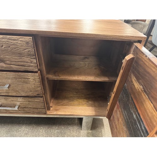 3230 - A three drawer two door sideboard with chrome handles *This lot is subject to VAT