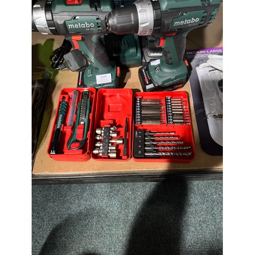 6104 - Two Metabo Drills with a charger, three batteries and a case containing accessories, Original RRP £9... 