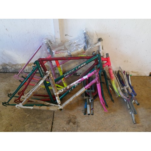 5301 - A quantity of assorted spare frames, forks handle bars and a large quantity of assorted spare bicycl... 