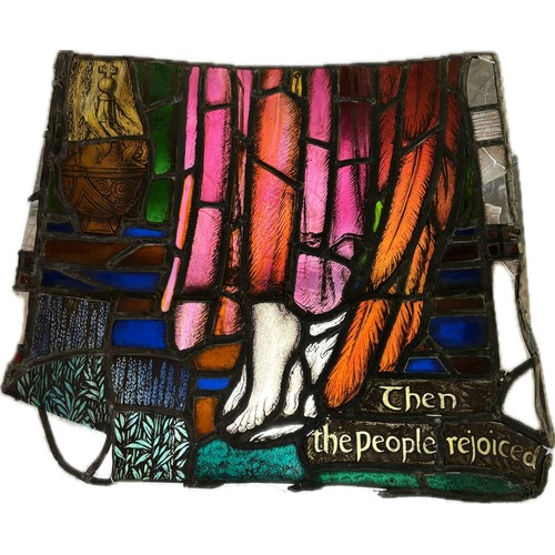 9043 - An Ecclesiastical leaded stained glass panel, in two sections, depicting an angel holding a censer, ... 