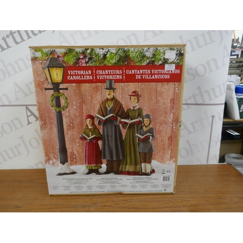 5323 - A battery operated light up Christmas decoration - Victorian carollers