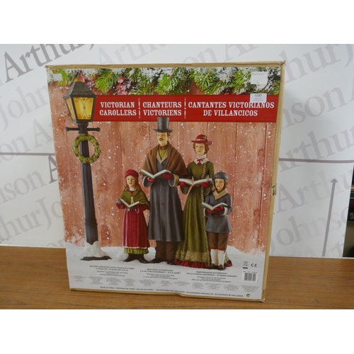 5324 - A battery operated light up Christmas decoration - Victorian carollers