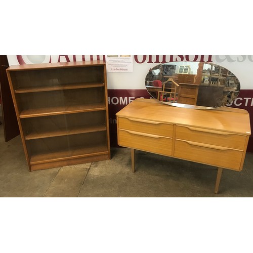 34 - A Herbert Gibbs teak bookcase and a teak dressing table