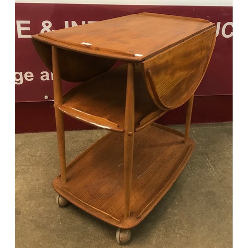 38 - An Ercol Blonde elm and beech Windsor drop-leaf trolley