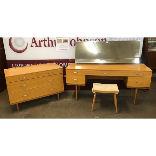 43 - A Stag teak dressing table, stool and chest of drawers