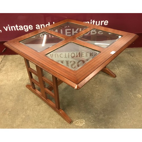 48 - A G-Plan teak and glass topped square coffee table