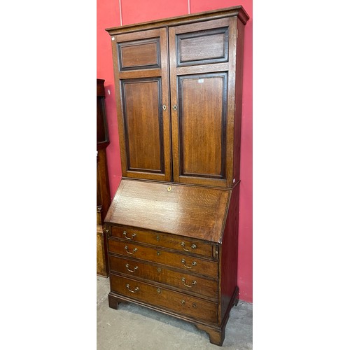 71 - A George III oak bureau bookcase