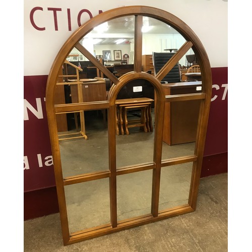 53 - A Cathedral style teak framed mirror