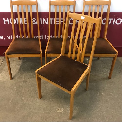 50A - A set of four teak dining chairs