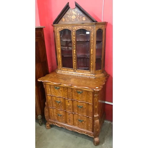 67 - A 19th Century Dutch marquetry inlaid walnut bookcase on chest