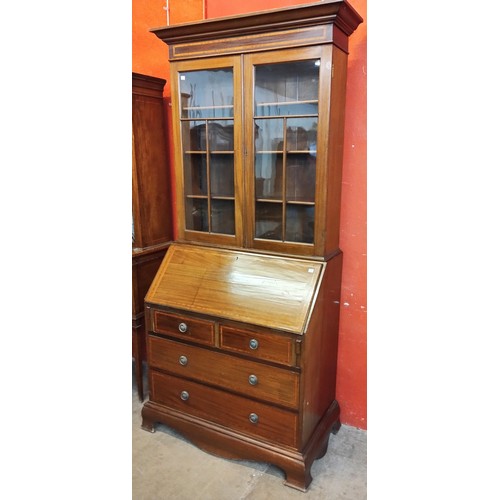 90 - A George III style inlaid mahogany bureau bookcase