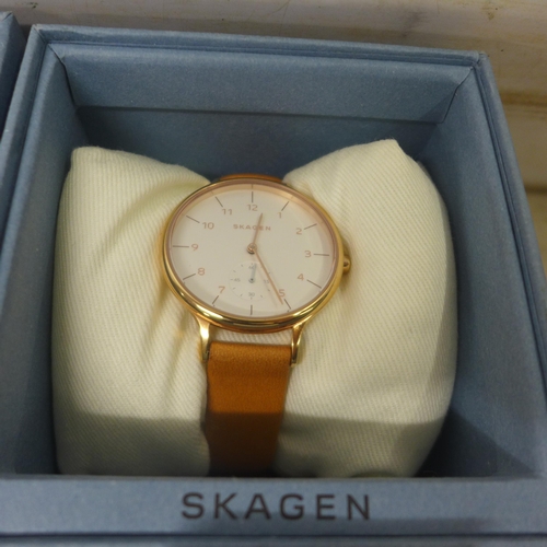 5100 - 2 Skagen lady's analogue watches in gold finish with light brown leather strap, unused