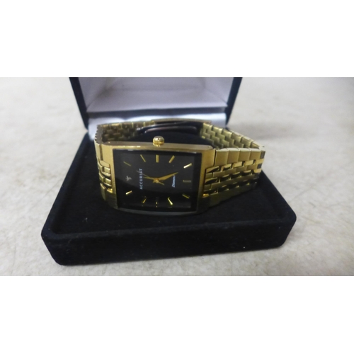 5103 - An Accurist gents analogue watch, square face with diamond at 12.00, gold finish, unused