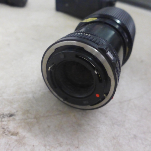 5115 - A Canon A-1 (22757-12) with an FD 35-70mm 1:3.5-4.5 Canon zoom lens, an FD 70-210mm 1:4 Canon Macro ... 