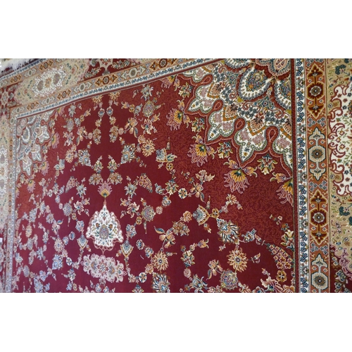 3066 - A fine woven Iranian full pile carpet with a traditional floral design, 300cm x 200cm