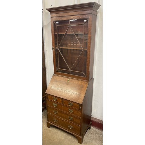 89 - A George III oak bureau bookcase